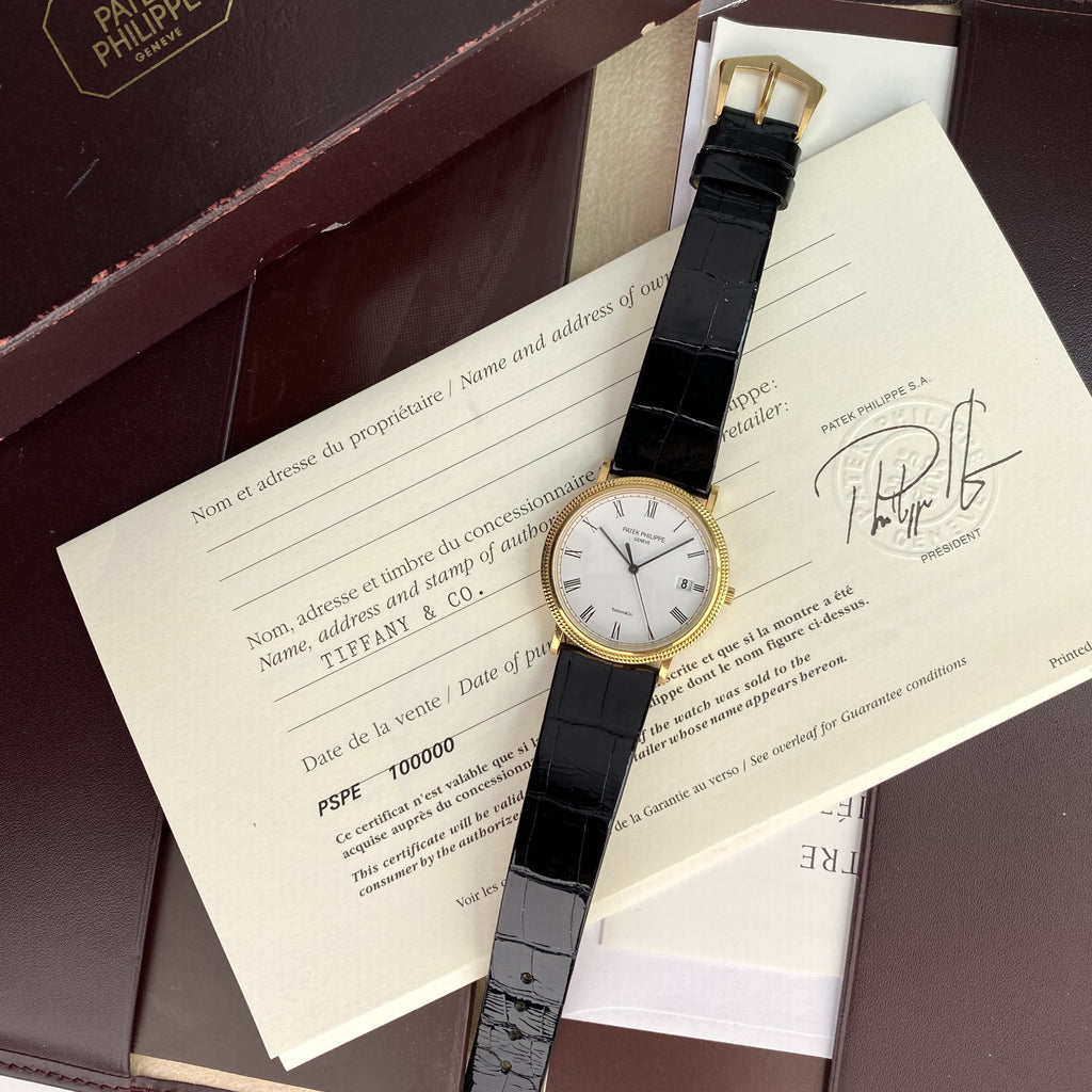 Patek Philippe Ref 3944 J Calatrava Retailed by Tiffany & Co.18k Yellow Gold Complete Set Box and Papers