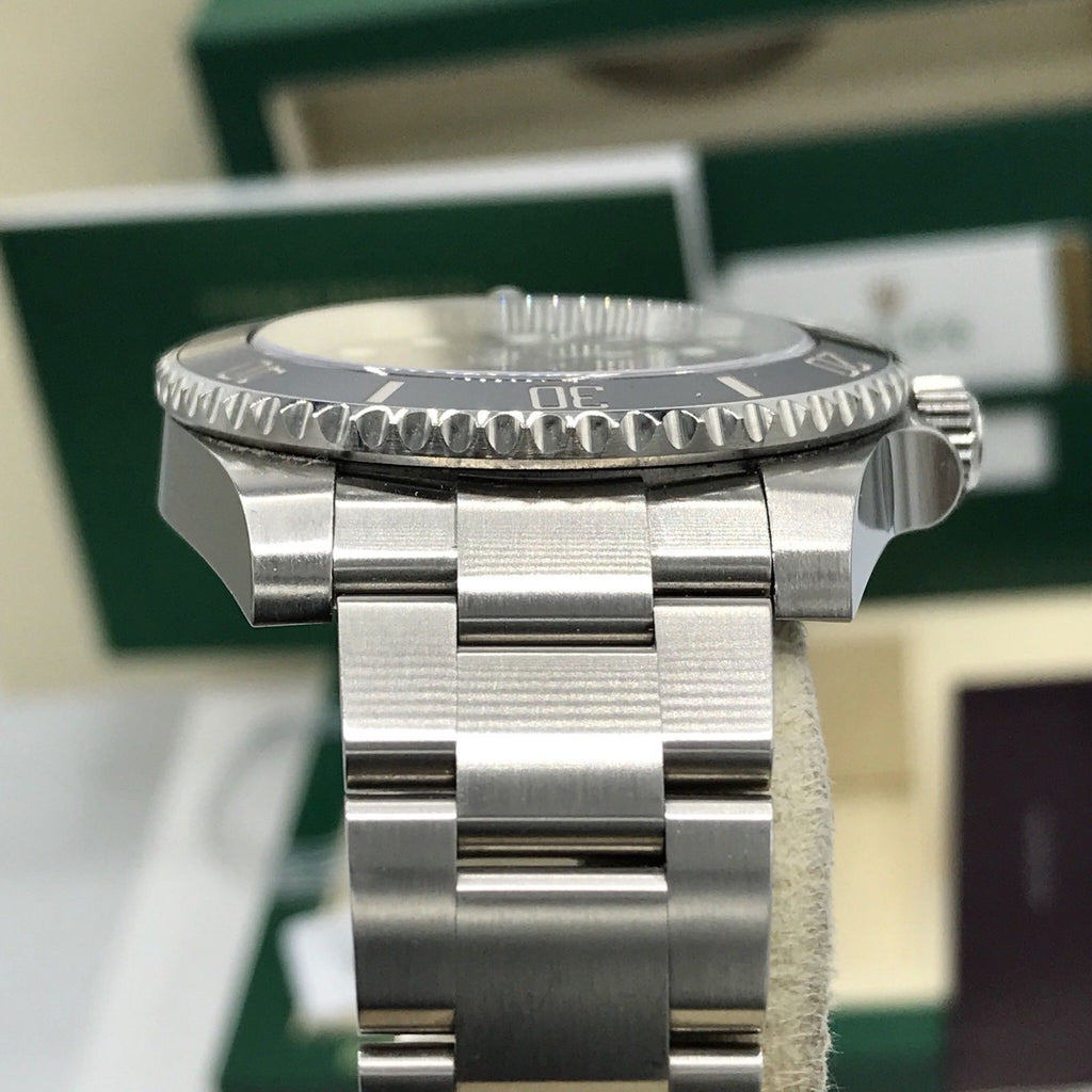 2017 Rolex Submariner 114060 No date Ceramic pre-owned box papers