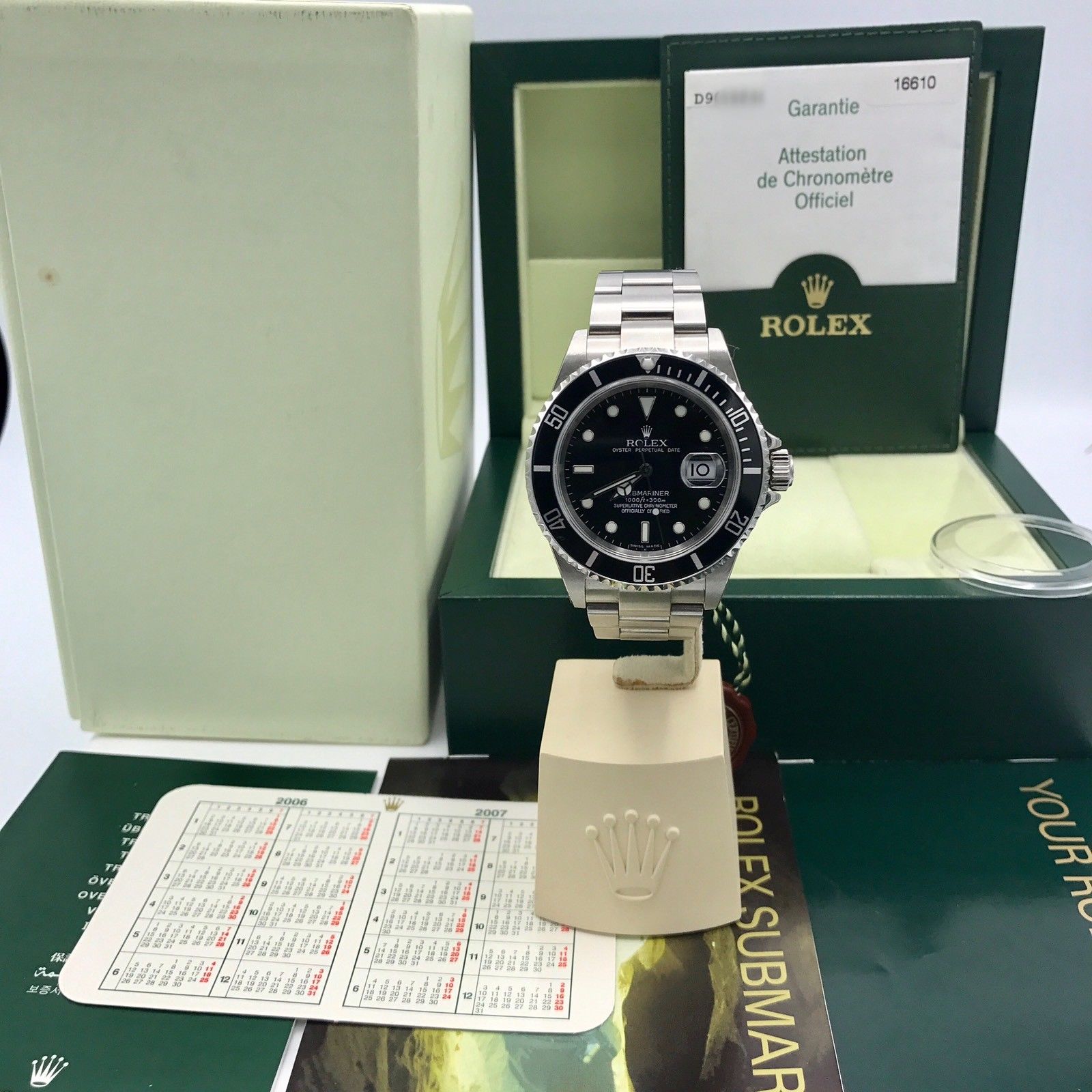Unworn Rolex Submariner 16610 FULL SET Papers D Serial 2006 NOS