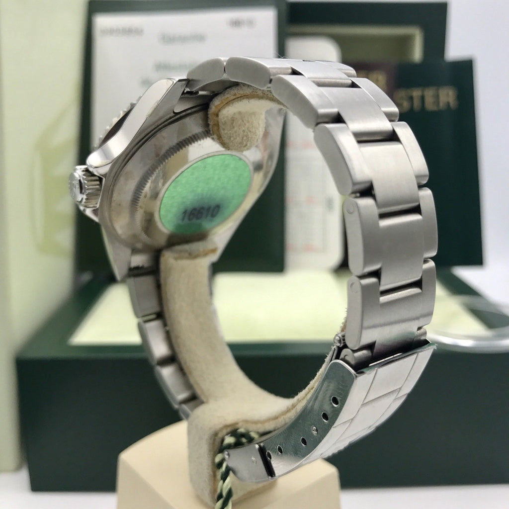 Unworn Rolex Submariner 16610 FULL SET Papers D Serial 2006 NOS